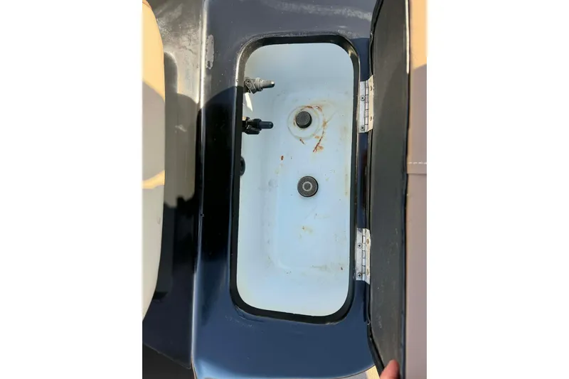 Slide: The Image of Open storage compartment in 2020 Excel 203 Bay Pro boat. - 16