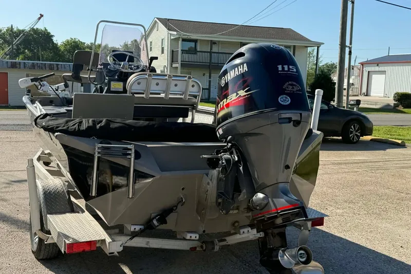 Slide: The Image of 2020 Excel 203 Bay Pro boat with Yamaha 115 engine on trailer. - 8