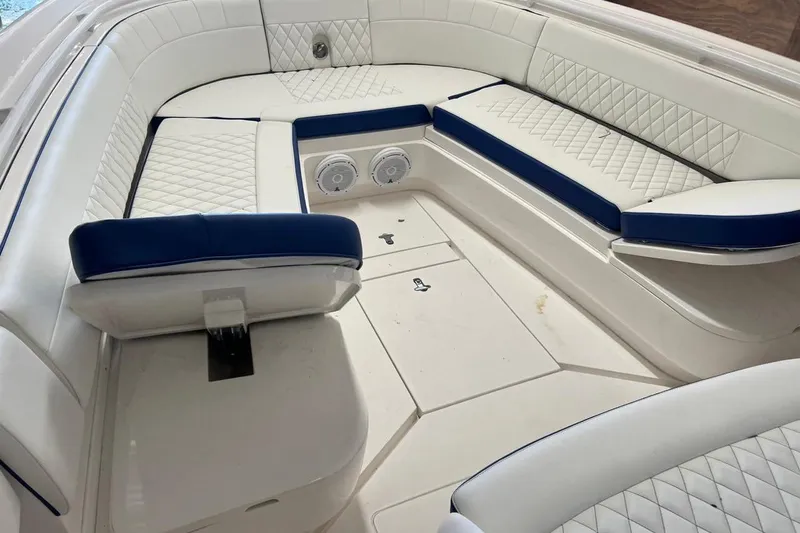 Slide: The Image of Luxurious seating area on a 2016 Intrepid 327 Center Console boat with quilted upholstery. - 3