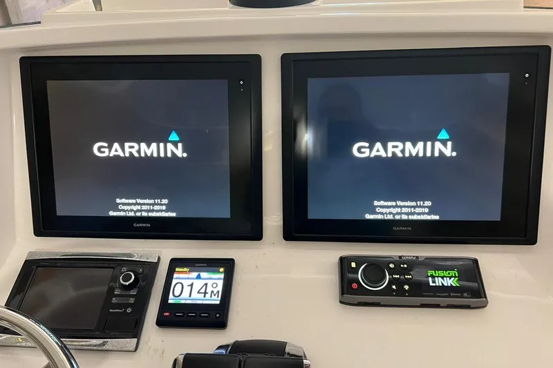 Slide: The Image of Garmin navigation system on 2016 Intrepid 327 Center Console boat dashboard. - 6