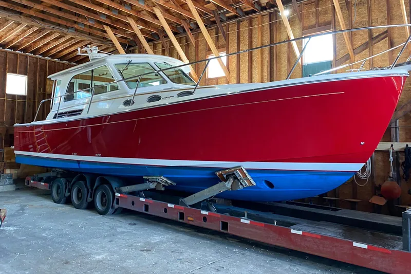 The Image of Red 2011 Back Cove 37 boat in storage facility. - 0