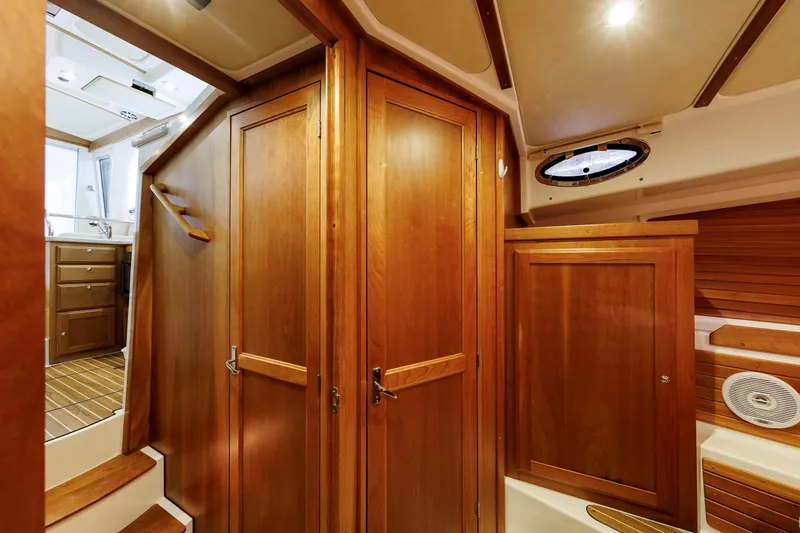 Slide: The Image of Interior of 2011 Back Cove 37 yacht with wooden cabinetry and stairs. - 18
