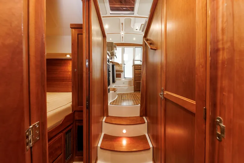 Slide: The Image of Interior of 2011 Back Cove 37 yacht with wooden finishes and cozy cabin space. - 22