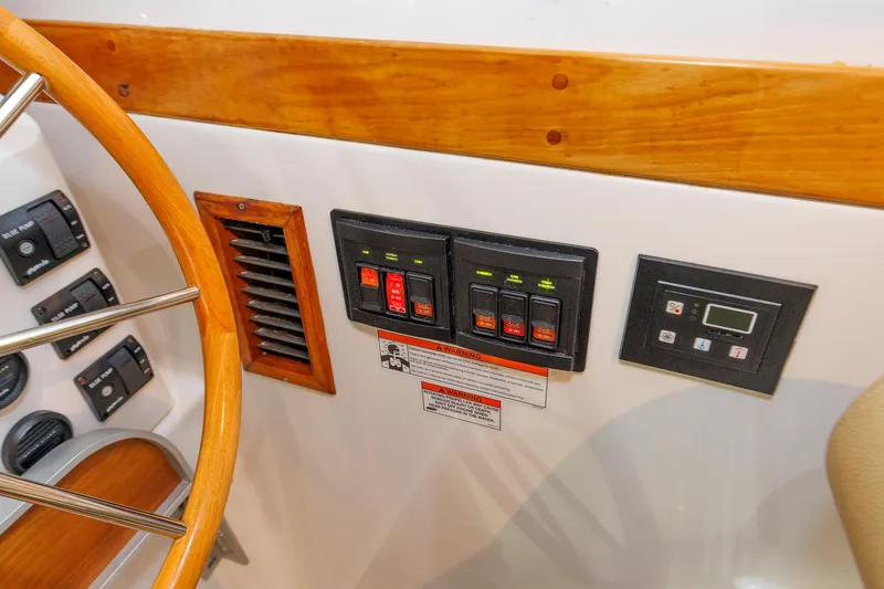Slide: The Image of Control panel and steering wheel of 2011 Back Cove 37 boat interior. - 35