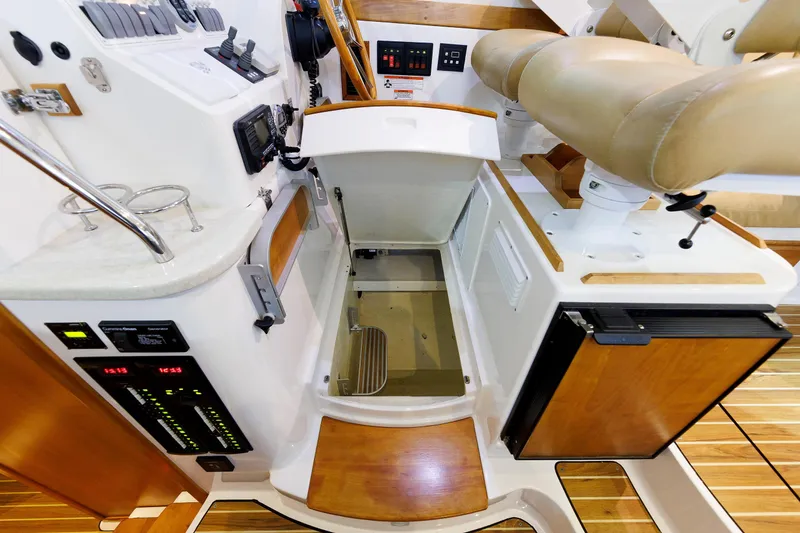 Slide: The Image of Helm station of 2011 Back Cove 37 boat with controls and seating. - 37
