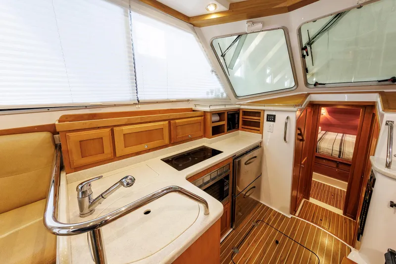 Slide: The Image of Luxurious 2011 Back Cove 37 yacht interior with modern kitchen and cozy cabin. - 40