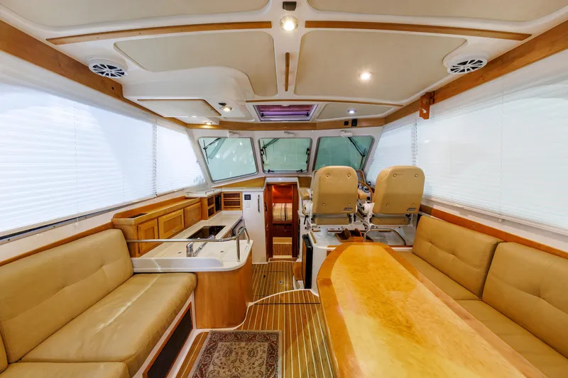 Slide: The Image of Luxurious interior of a 2011 Back Cove 37 yacht with plush seating and modern helm. - 41
