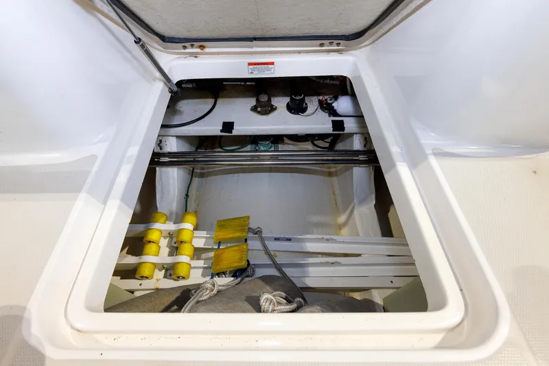 Slide: The Image of Open hatch of 2011 Back Cove 37 boat showing interior storage compartment. - 47