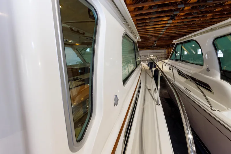 Slide: The Image of 2011 Back Cove 37 yacht in storage, showcasing sleek design and polished exterior. - 8