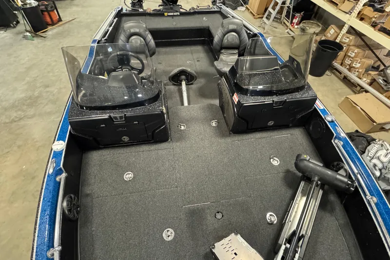 Slide: The Image of 2020 Nitro ZV20 boat interior with dual consoles and seating in a workshop setting. - 13