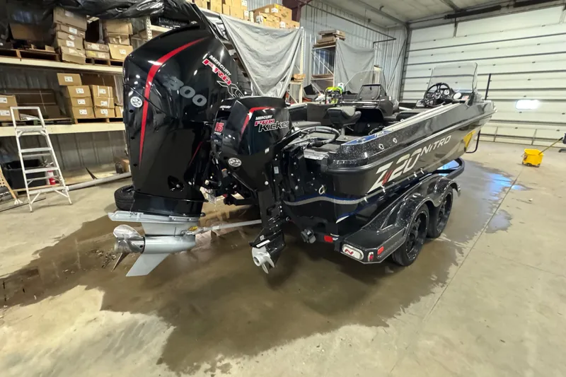 Slide: The Image of 2020 Nitro ZV20 boat with dual Mercury engines in a garage setting. - 3