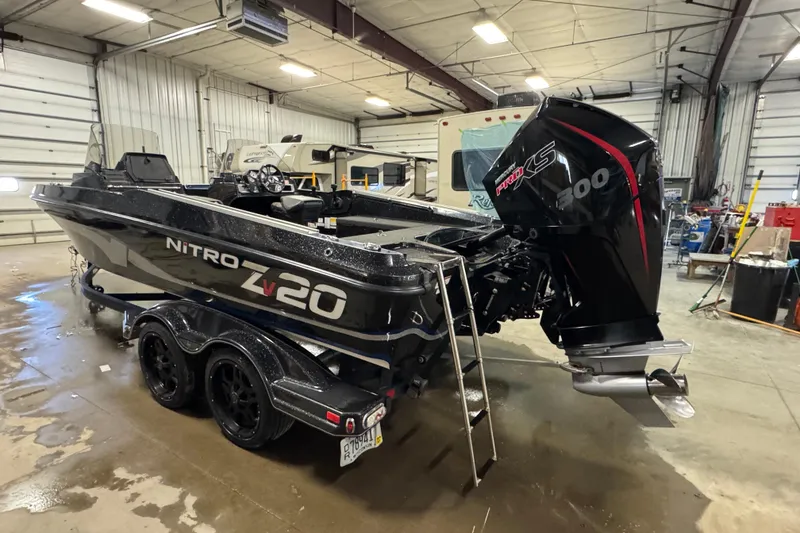 Slide: The Image of 2020 Nitro ZV20 boat with powerful engine in a spacious garage setting. - 4