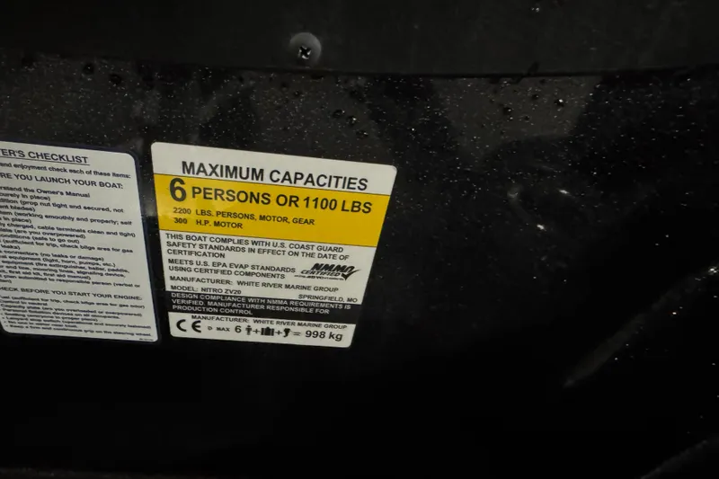 Slide: The Image of Label on Nitro ZV20 boat showing maximum capacity of 6 persons or 1100 lbs. - 9
