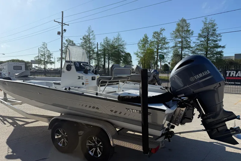 Slide: The Image of 2023 Xpress H22B Bay boat with Yamaha engine on trailer. - 4