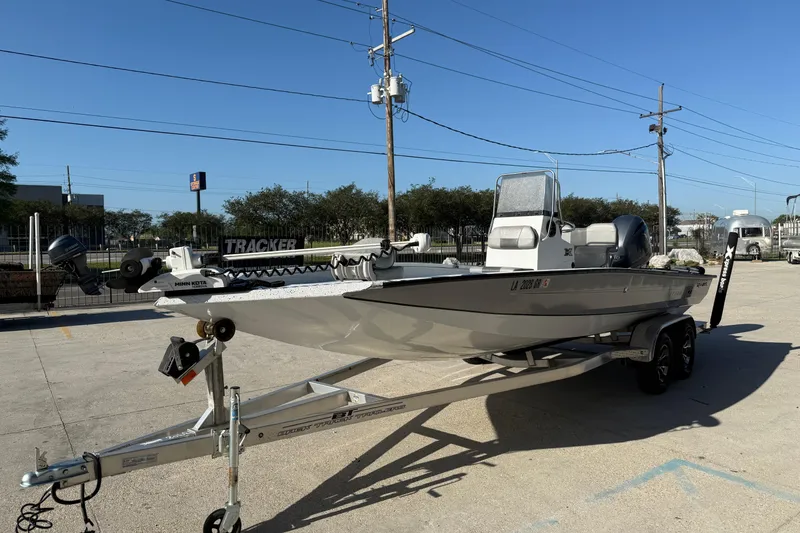 Slide: The Image of 2023 Xpress H22B Bay boat on trailer in outdoor setting. - 6