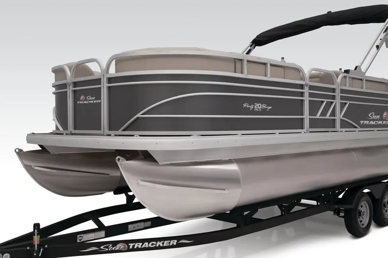 Slide: The Image of 2023 Sun Tracker Party Barge 20 DLX on trailer, side view. - 18