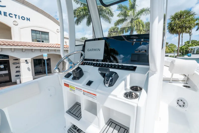 Slide: The Image of 2026 Sea Hunt Ultra 235 SE boat console with Garmin display. - 14