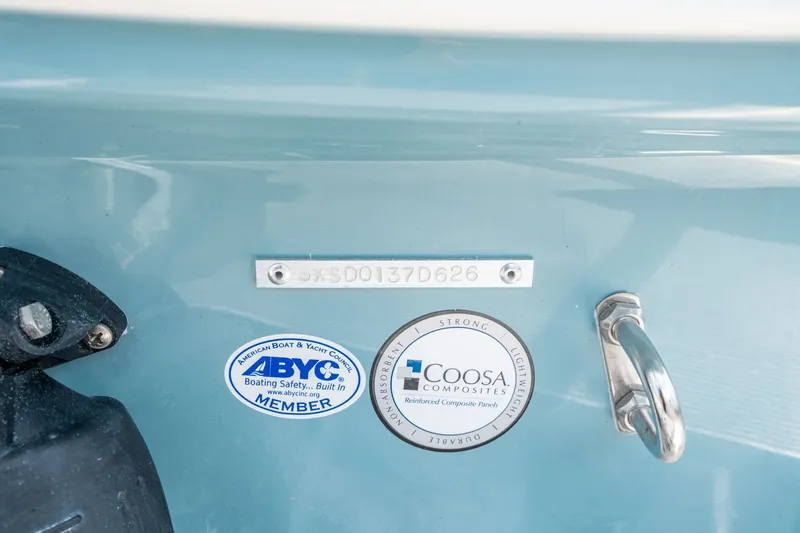 Slide: The Image of Sea Hunt Ultra 235 SE 2026 with ABYC and Coosa emblems. - 23