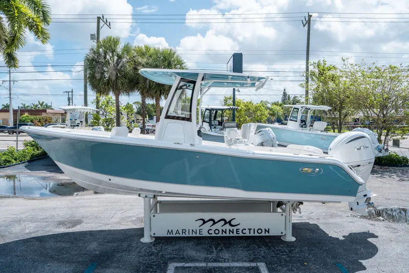 Slide: The Image of 2026 Sea Hunt Ultra 235 SE boat on display stand. - 5