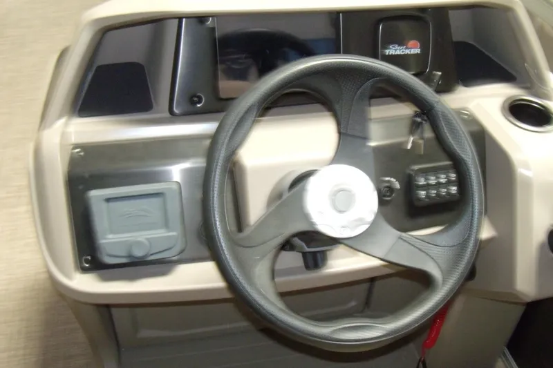 Slide: The Image of Steering console of 2024 Sun Tracker Party Barge 18 DLX pontoon boat. - 2