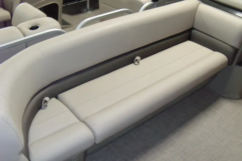 Slide: The Image of 2024 Sun Tracker Party Barge 18 DLX interior seating, featuring comfortable beige upholstery. - 6