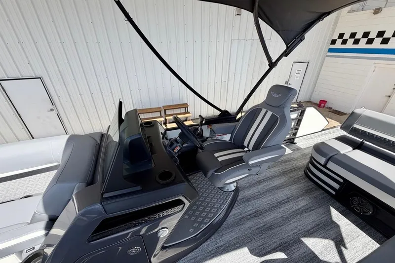 Slide: The Image of 2026 Bennington 23 M Swingback boat interior with modern seating and sleek design. - 11