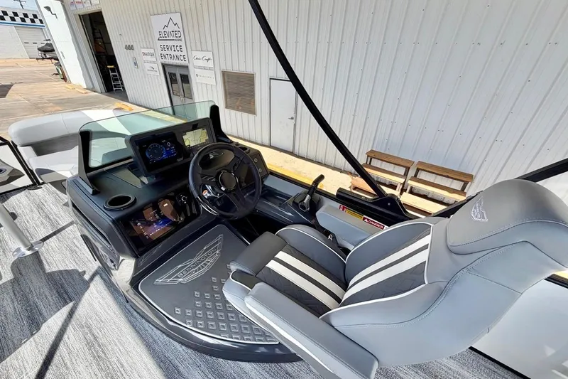Slide: The Image of Interior view of 2026 Bennington 23 M Swingback boat with modern dashboard and seating. - 12