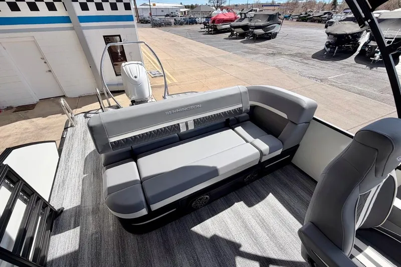 Slide: The Image of 2026 Bennington 23 M Swingback pontoon boat with sleek gray seating and modern design. - 13