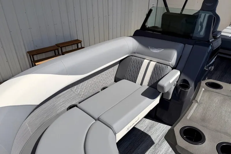 Slide: The Image of 2026 Bennington 23 M Swingback boat interior with luxurious seating and cup holders. - 16