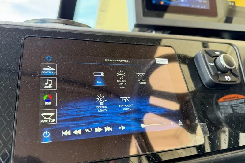Slide: The Image of Touchscreen control panel of a 2026 Bennington 23 M Swingback boat, displaying various settings. - 24
