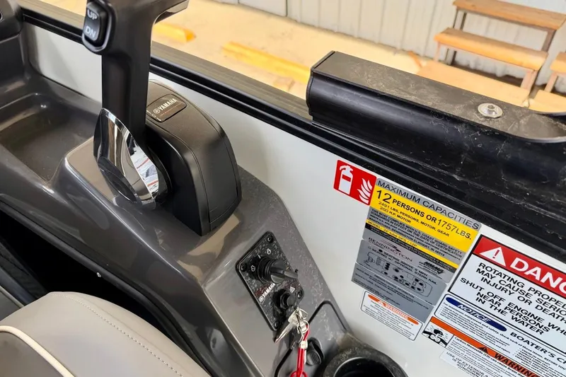 Slide: The Image of Control panel of 2026 Bennington 23 M Swingback boat with capacity and safety labels. - 27