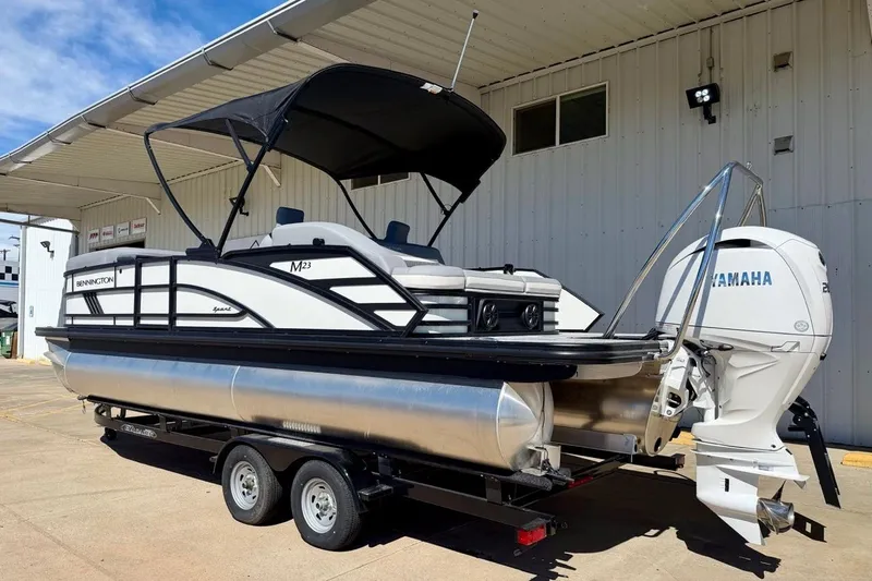 Slide: The Image of 2026 Bennington 23 M Swingback pontoon boat with Yamaha engine on trailer. - 4