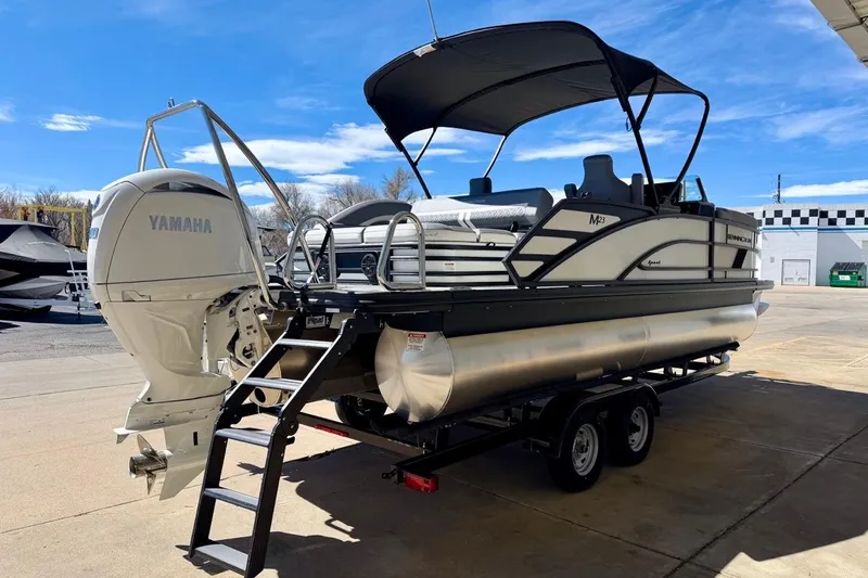 Slide: The Image of 2026 Bennington 23 M Swingback pontoon boat with Yamaha engine on trailer. - 6