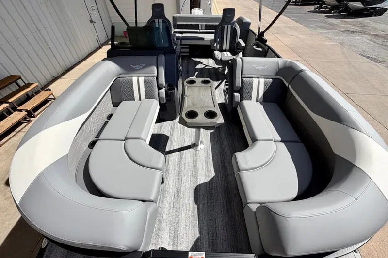 Slide: The Image of 2026 Bennington 23 M Swingback pontoon boat interior with gray seating and table. - 9