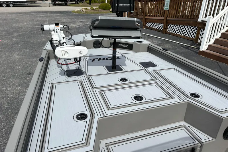 Slide: The Image of 2025 Thor Lake Hammer 1900CC Elite boat deck with advanced equipment and sleek design. - 13