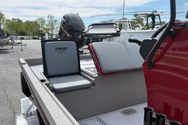 Slide: The Image of 2025 Thor Lake Hammer 1900CC Elite boat interior with seating and motor. - 15