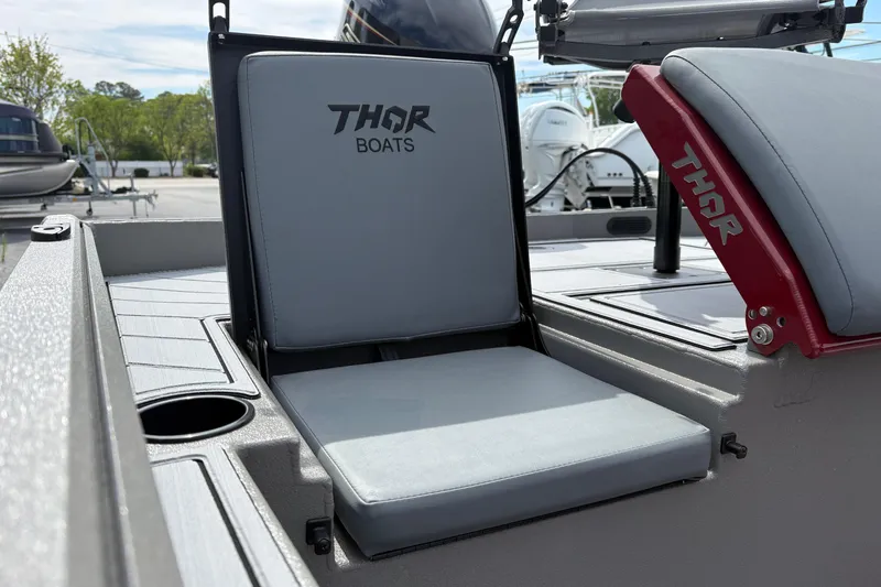 Slide: The Image of Thor Lake Hammer 1900CC Elite 2025 boat seat with logo, featuring sleek design. - 16