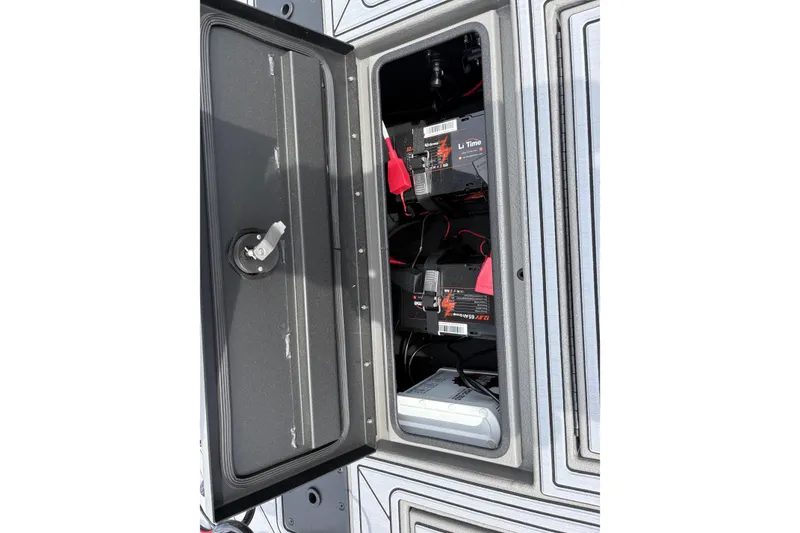 Slide: The Image of Open battery compartment of 2025 Thor Lake Hammer 1900CC Elite, showcasing lithium batteries. - 20