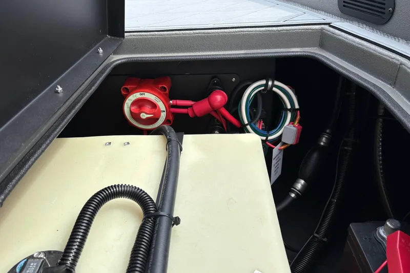 Slide: The Image of Interior view of 2025 Thor Lake Hammer 1900CC Elite boat's electrical system components. - 21