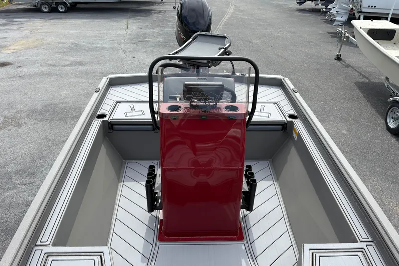 Slide: The Image of 2025 Thor Lake Hammer 1900CC Elite boat with red console and sleek design. - 8