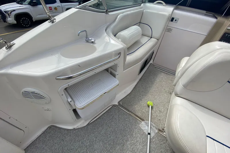 Slide: The Image of 2002 Chaparral Signature 240 boat interior with sink, cooler, and seating area. - 12