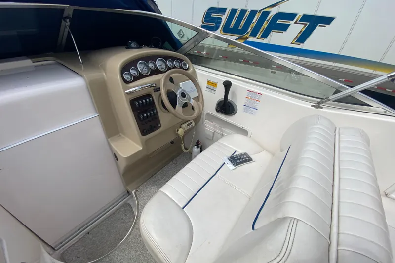 Slide: The Image of 2002 Chaparral Signature 240 boat cockpit with steering wheel and control panel. - 14