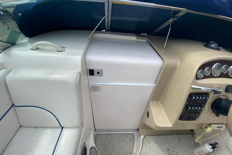Slide: The Image of 2002 Chaparral Signature 240 boat interior with dashboard and seating area. - 17
