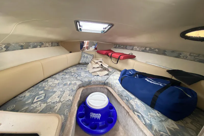 Slide: The Image of Interior cabin of 2002 Chaparral Signature 240 boat with seating and storage. - 19