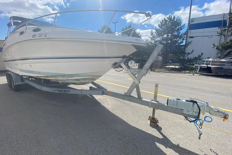 Slide: The Image of 2002 Chaparral Signature 240 boat on trailer under sunny sky. - 5