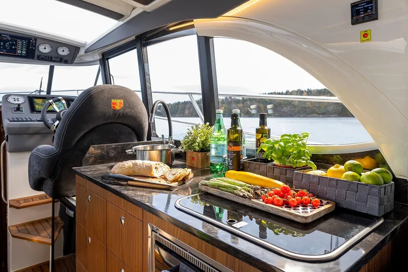 Slide: The Image of Manufacturer Provided Image: Marex 330 Scandinavia 2026 yacht interior with kitchen and helm. - 10