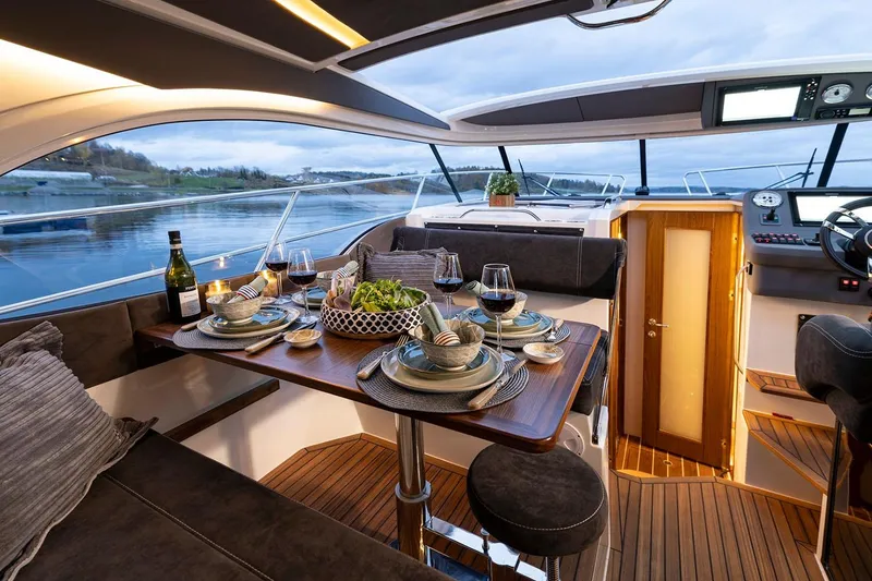 Slide: The Image of Manufacturer Provided Image: Luxurious interior of Marex 330 Scandinavia yacht, set dining table, 2026 model. - 11