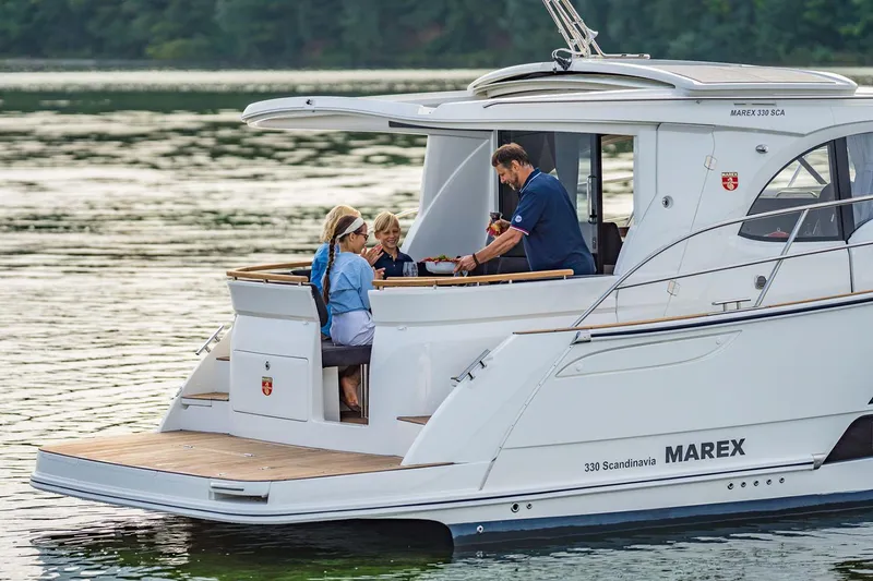 Slide: The Image of Manufacturer Provided Image: Marex 330 Scandinavia 2026 on calm water with passengers. - 5