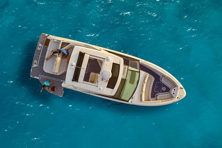 Slide: The Image of Manufacturer Provided Image: Aerial view of 2023 Sea Ray SLX 400 boat on clear blue water. - 17