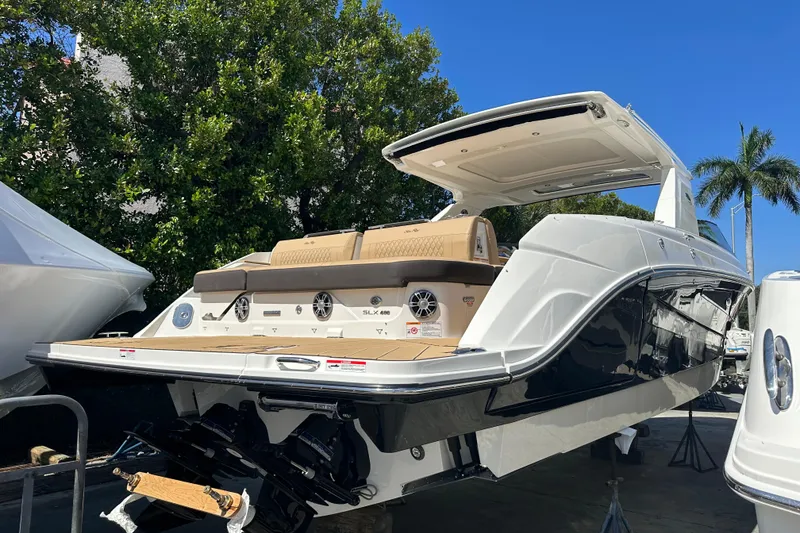 Slide: The Image of 2023 Sea Ray SLX 400 luxury boat with sleek design, docked outdoors. - 20
